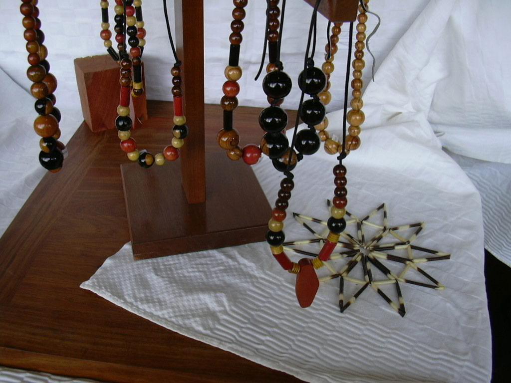 Beads of red ivory, mopane, African blackwood, tambotie (African cocobolo) and African olive.