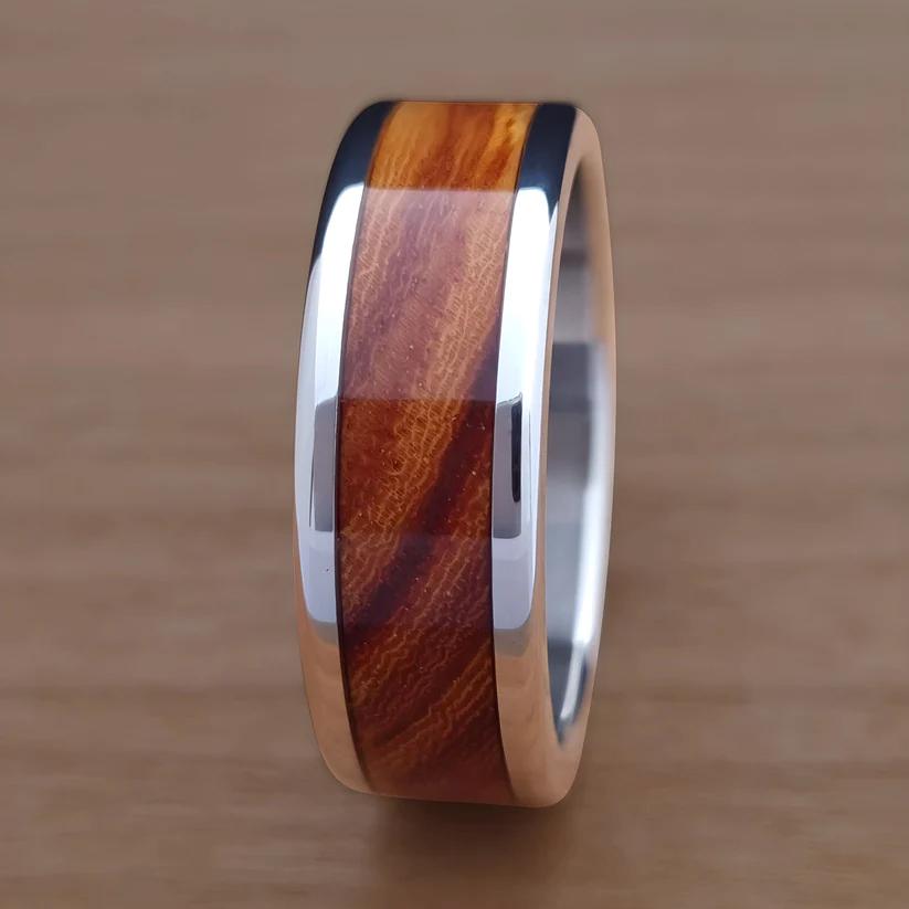 An inlay ring made from ironwood and stainless steel.