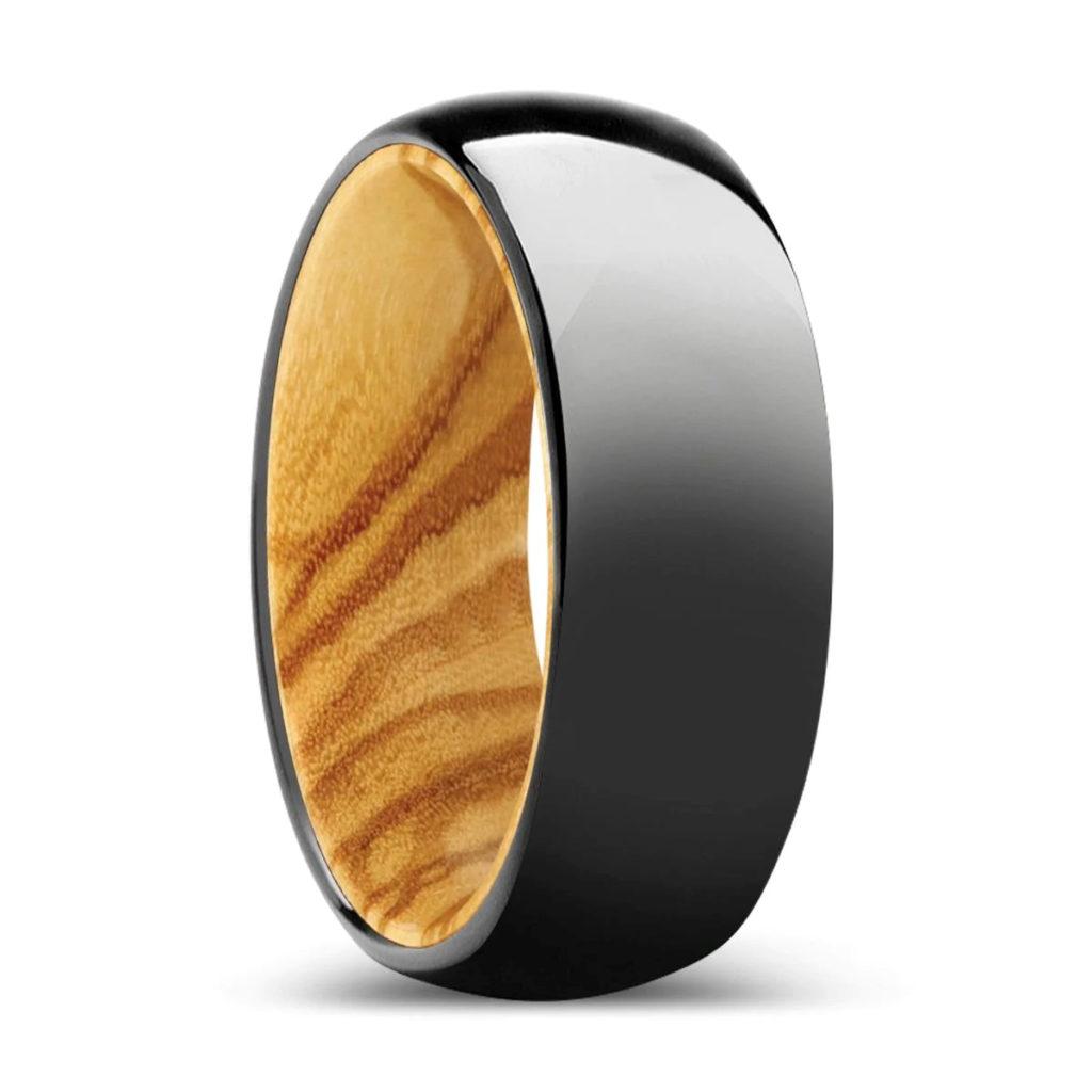 A ring of olive wood and tungsten. 