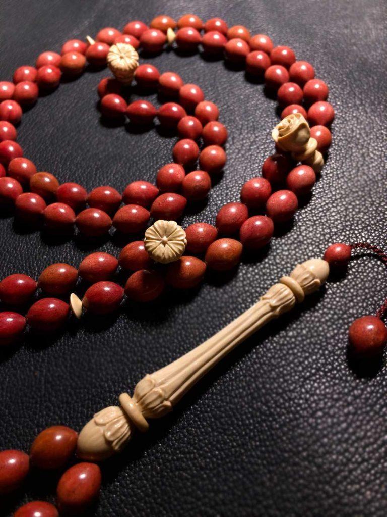 Prayer beads made from red ivory hardwood. 