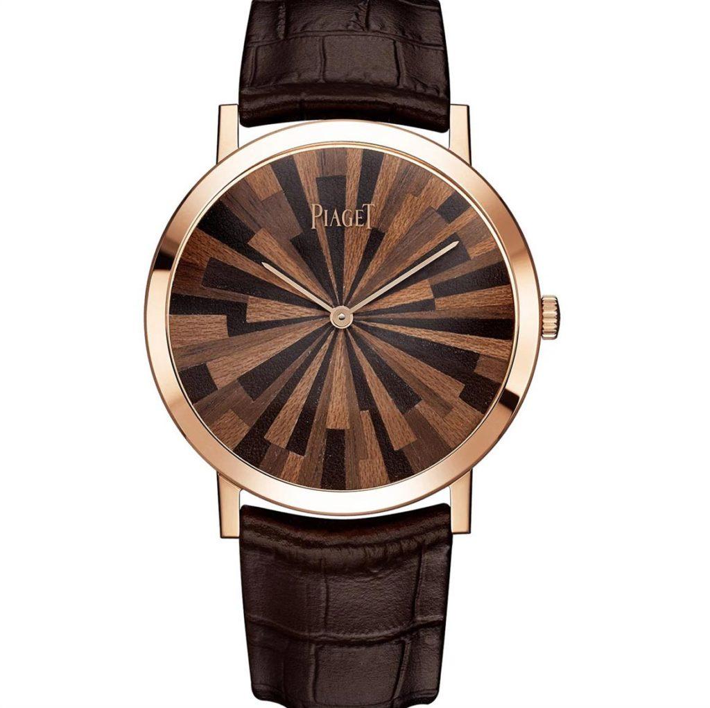 A Piaget watch, with a leather and wood marquetry dial.