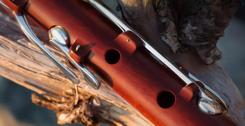 A richly coloured red ivory flute.